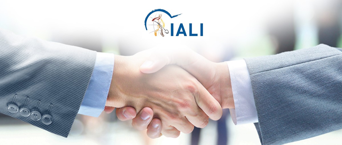 IALI graphics two men shaking hands